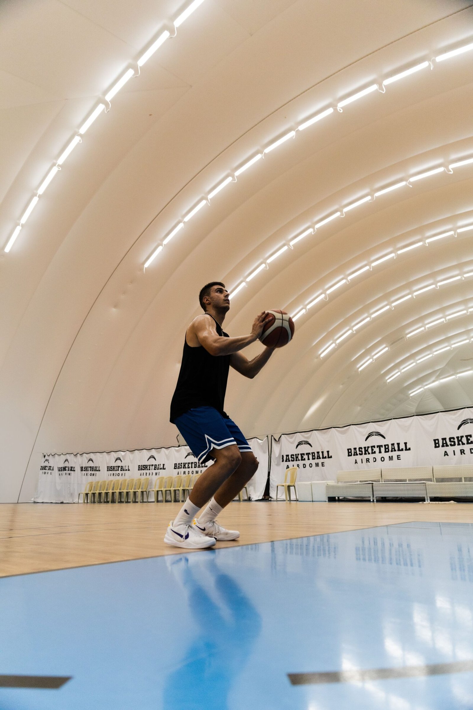 A basketball player rises for a shot in an indoor arena, evoking the Philadelphia 76ers new-look 2026-27 rotation (Photo: Pexels)