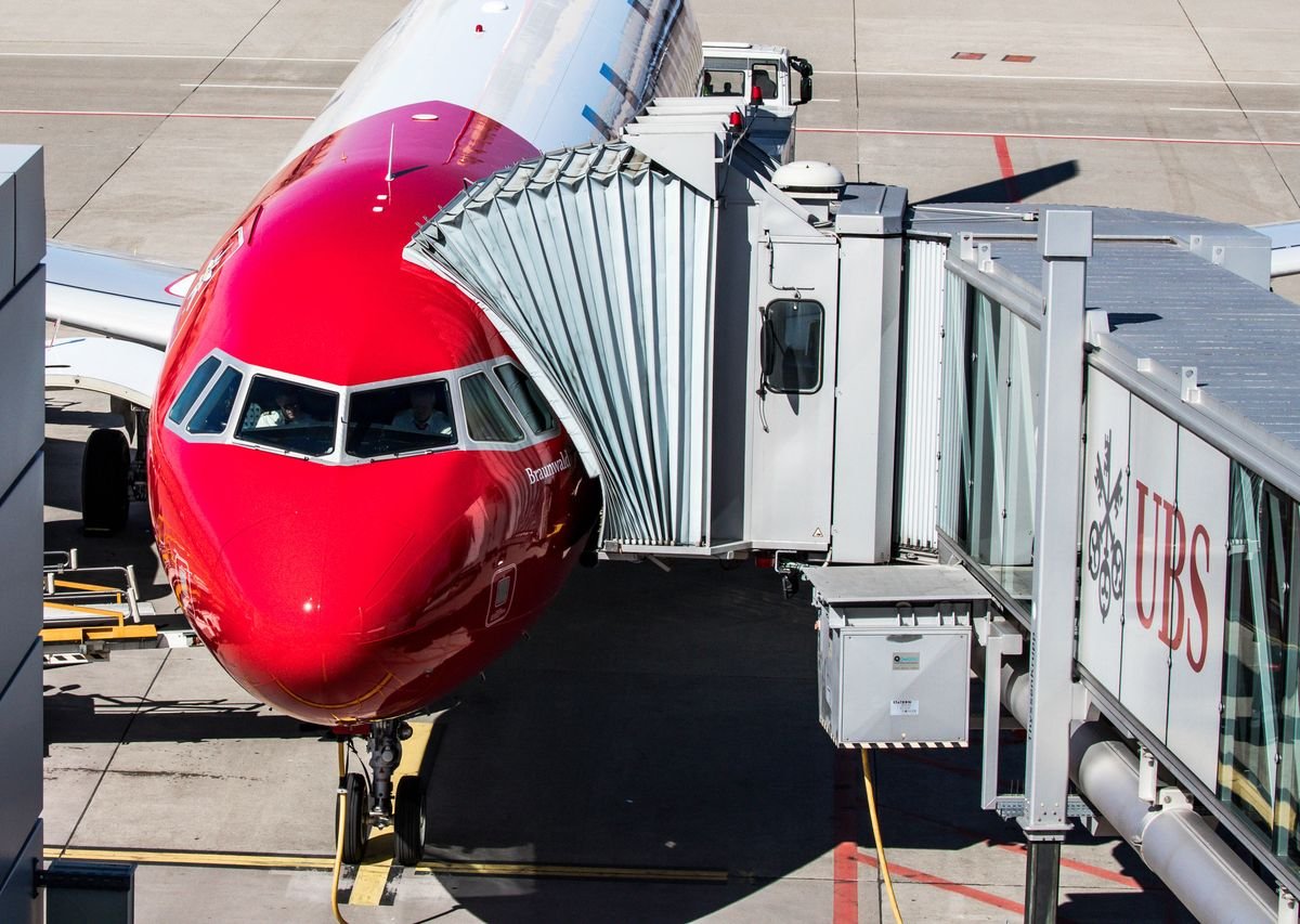 An American Airlines jet held at the gate during a ground stop