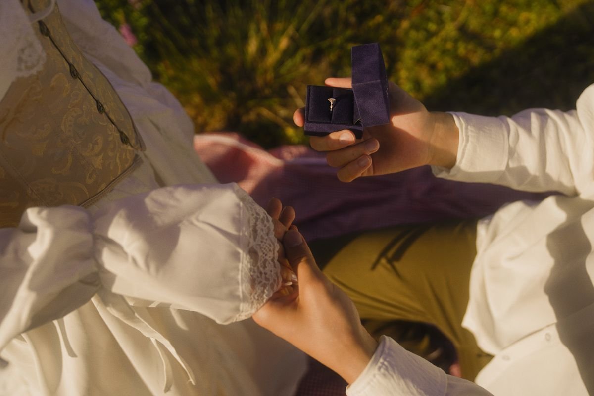 A romantic outdoor marriage proposal scene