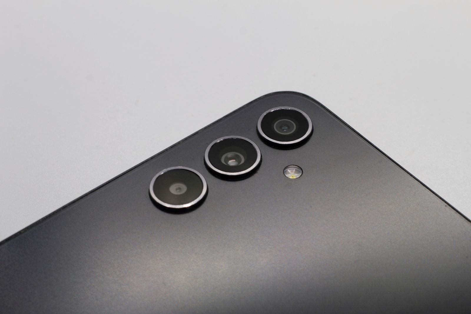Close-up of a modern smartphone triple-camera module, illustrating the kind of camera hardware rumored for the iPhone 18 Pro