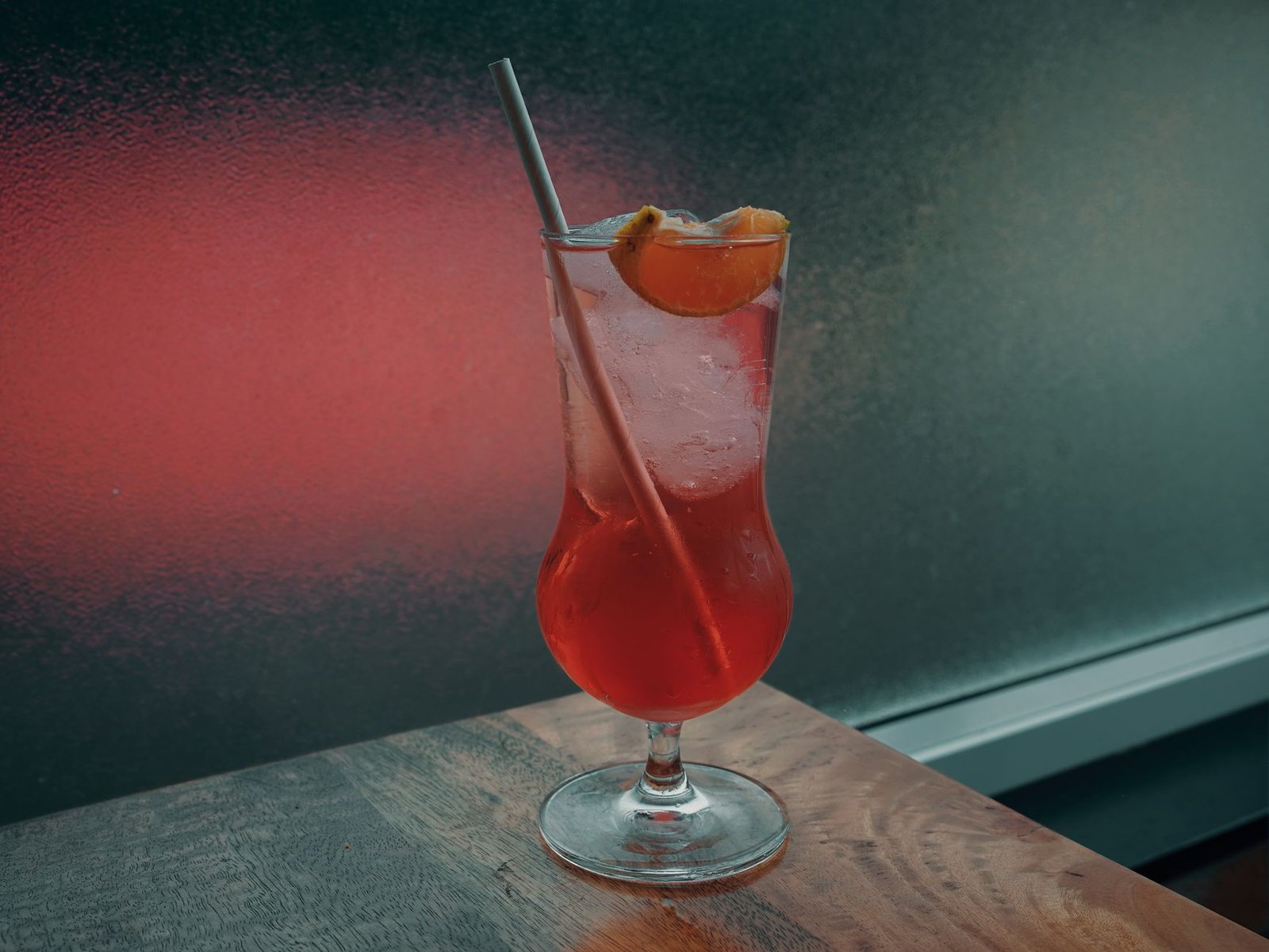 Young people enjoying non-alcoholic mocktails at a social gathering, reflecting the sober curious movement.
