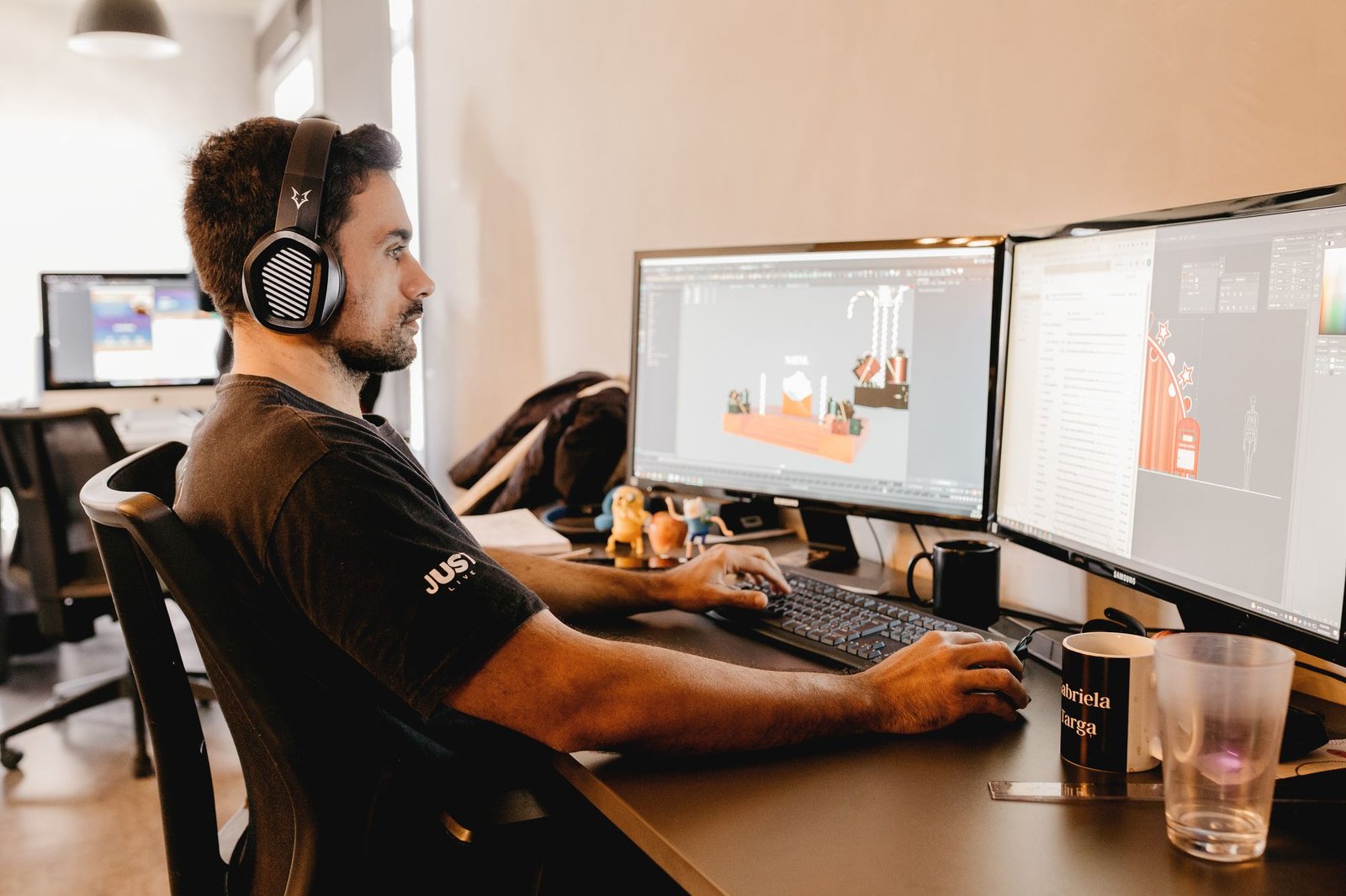 A developer or creator working on a detailed digital map project at a computer workstation.