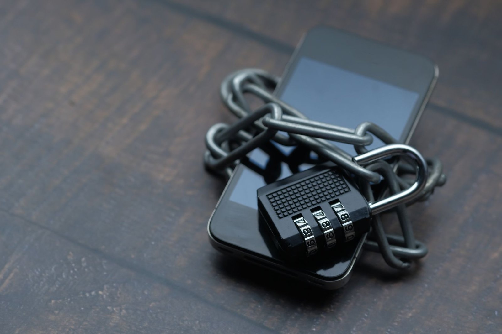 Close-up of a smartphone displaying a digital security lock icon