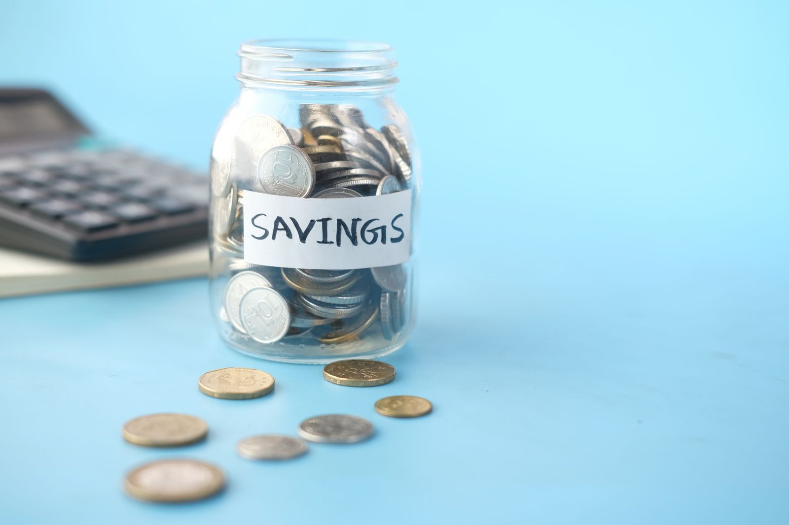 Jar of coins representing a growing savings fund