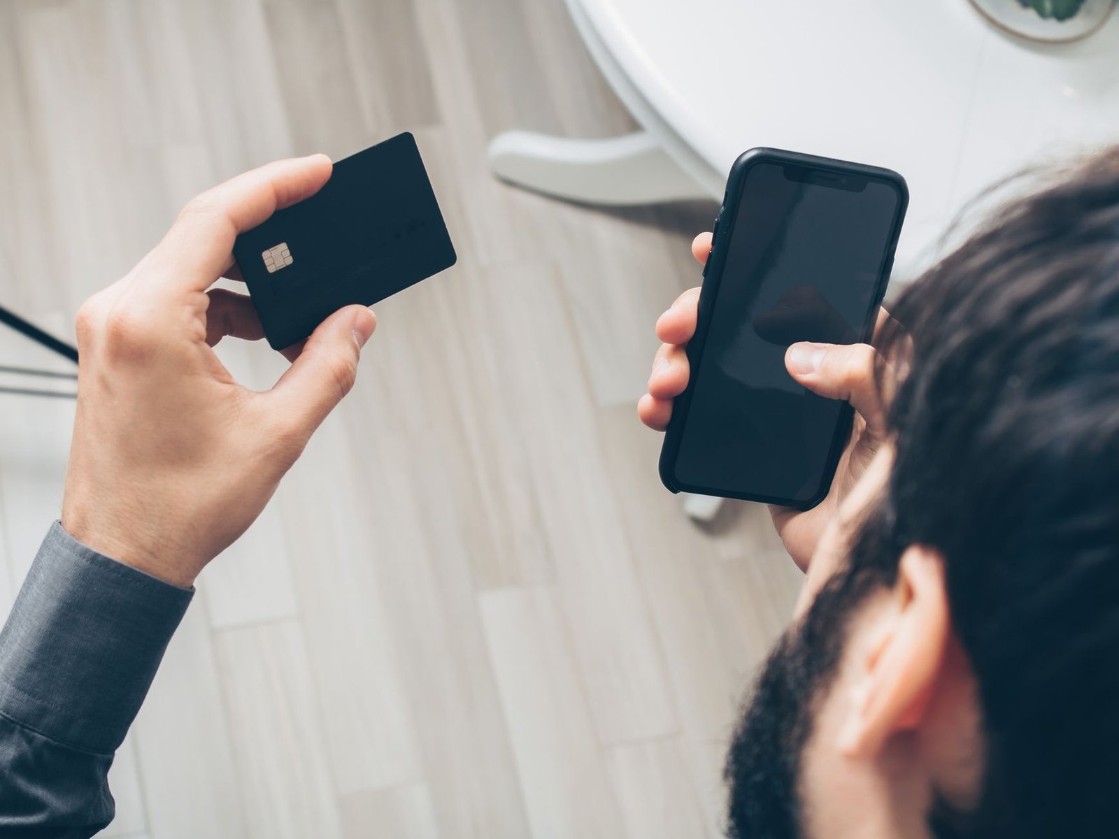Close-up of a smartphone showing a payment security alert during checkout