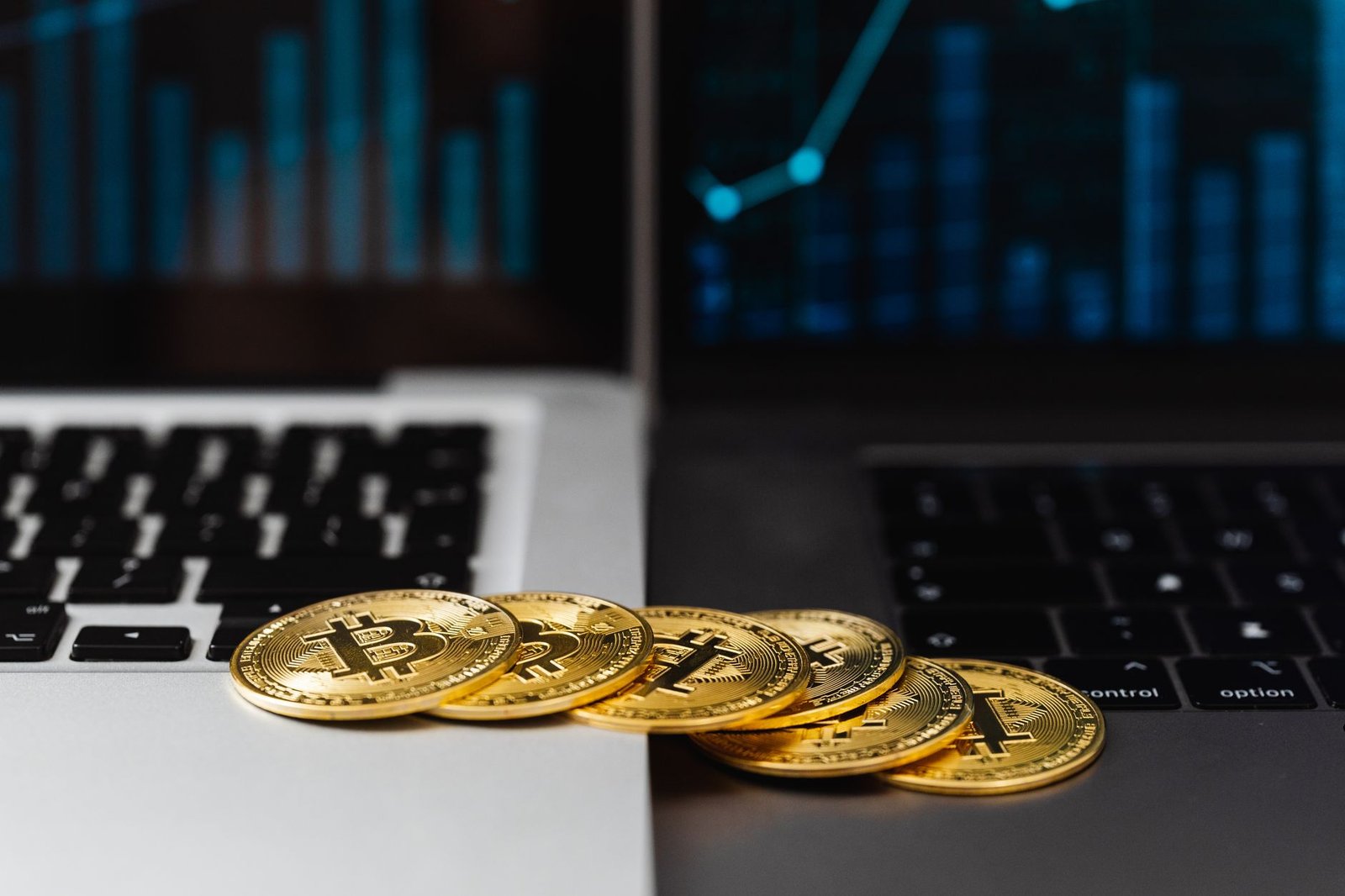 Digital cryptocurrency coins displayed on a laptop screen